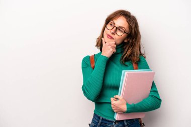Young student caucasian woman isolated on white background looking sideways with doubtful and skeptical expression.