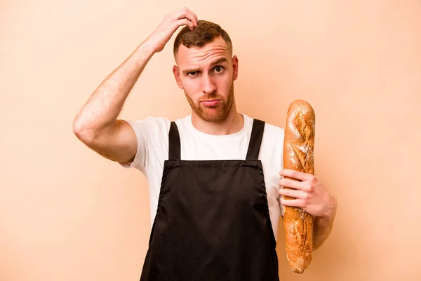 Young Baker Caucasian Man Isolated Beige Background Being Shocked She — Stock Photo, Image