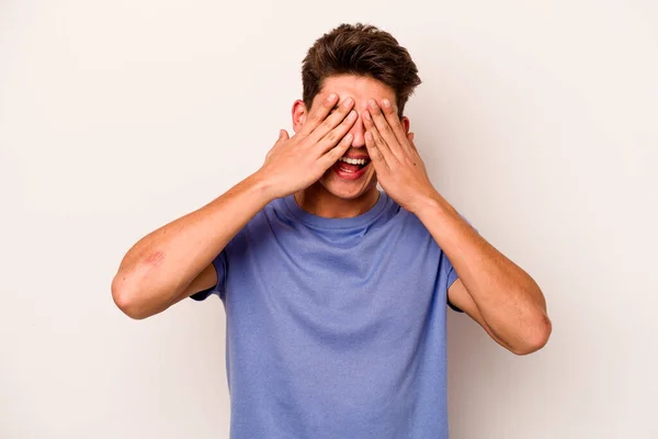 Young Caucasian Man Isolated White Background Covers Eyes Hands Smiles — Stock Photo, Image