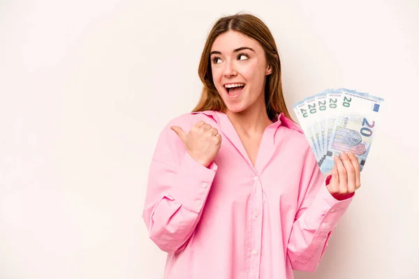 Young Woman Holding Banknotes Isolated White Background Points Thumb Finger — Stock Photo, Image