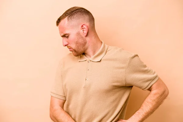 Young Caucasian Man Isolated Beige Background Suffering Back Pain — Stock Photo, Image