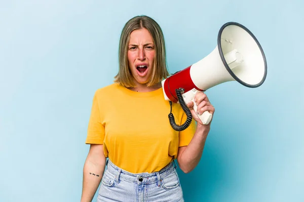 Young Caucasian Woman Holding Megaphone Isolated Blue Background Screaming Very — Stockfoto