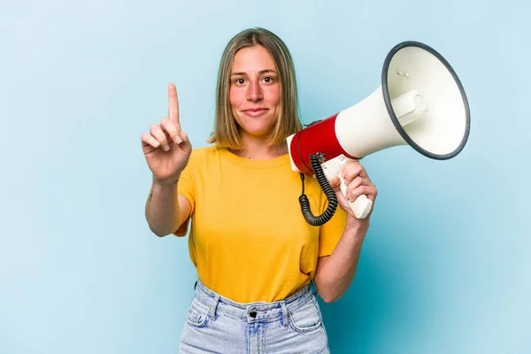 Young Caucasian Woman Holding Megaphone Isolated Blue Background Showing Number — Stockfoto
