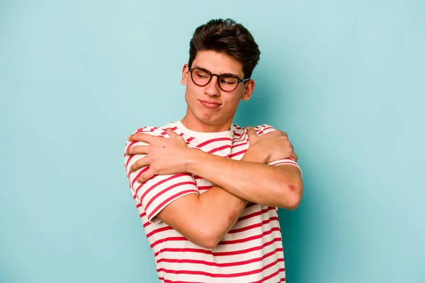 Young Caucasian Man Isolated Blue Background Hugs Smiling Carefree Happy — Stock Photo, Image