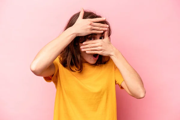 Young Caucasian Woman Isolated Pink Background Blink Camera Fingers Embarrassed — Stock Photo, Image