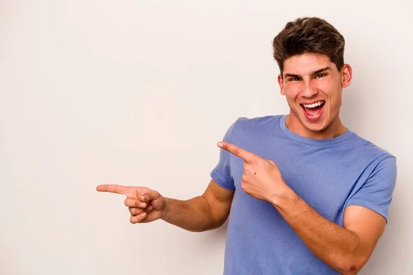 Young Caucasian Man Isolated White Background Excited Pointing Forefingers Away — Stock Photo, Image