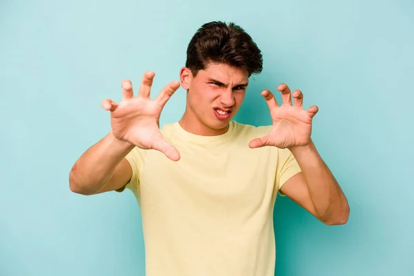 Young Caucasian Man Isolated Blue Background Showing Claws Imitating Cat — Stock Photo, Image