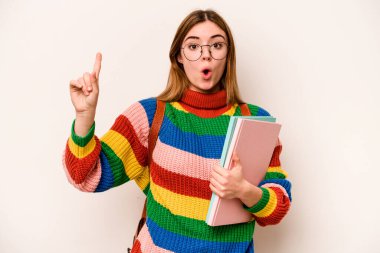Young student caucasian woman isolated on white background having some great idea, concept of creativity.