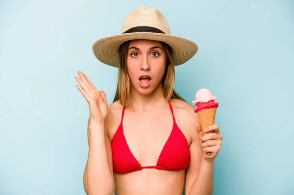 Young Caucasian Woman Wearing Bikini Holding Ice Cream Isolated Blue — Stock Photo, Image