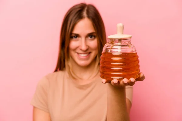 Young Caucasian Woman Holding Honey Isolated Pink Background — Stock Photo, Image