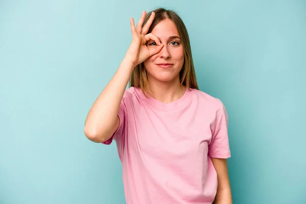 Young Caucasian Woman Isolated Blue Background Excited Keeping Gesture Eye — Stock Photo, Image