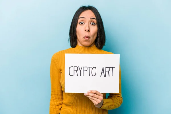 Young Hispanic Woman Holding Crypto Art Placard Isolated Blue Background — Stock Photo, Image