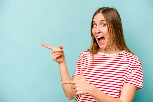 Young Caucasian Woman Isolated Blue Background Excited Pointing Forefingers Away — Stock Photo, Image