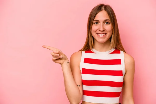 Young Caucasian Woman Isolated Pink Background Smiling Cheerfully Pointing Forefinger — Stock Photo, Image