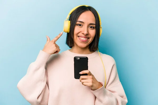 Young Hispanic Woman Listening Music Isolated Blue Background — Stock Photo, Image
