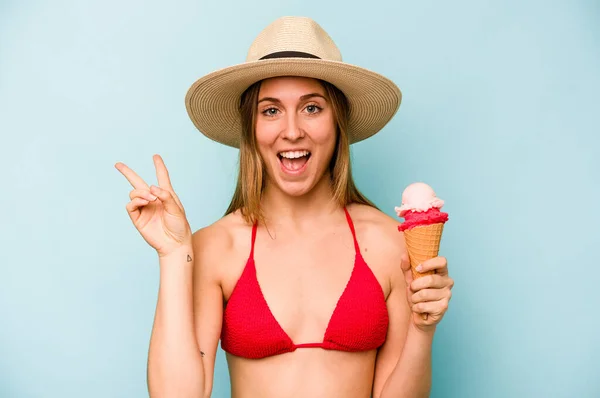 Young Caucasian Woman Wearing Bikini Holding Ice Cream Isolated Blue — Stock Photo, Image