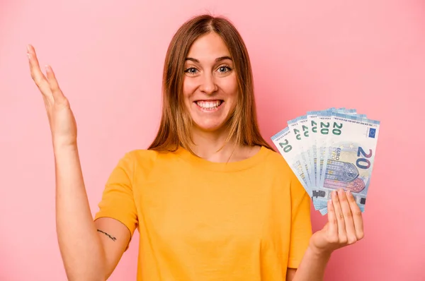 Young Caucasian Woman Holding Banknotes Isolated Pink Background Receiving Pleasant — Stock Photo, Image