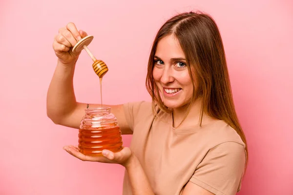 Young Caucasian Woman Holding Honey Isolated Pink Background — Stock Photo, Image