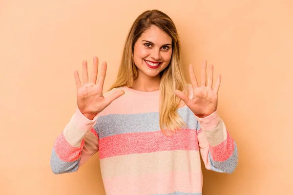 Young Caucasian Woman Isolated Beige Background Showing Number Ten Hands — Stock Photo, Image