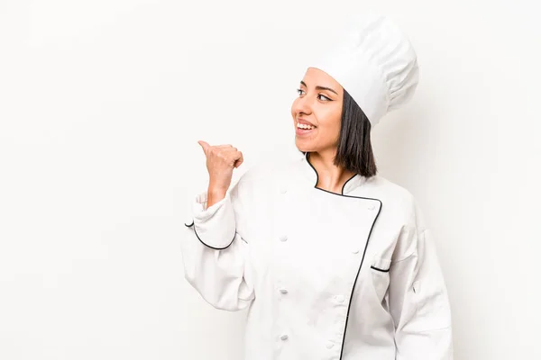 Young Hispanic Chef Woman Isolated White Background Points Thumb Finger — Stockfoto