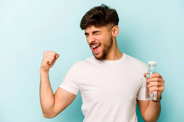 Young Hispanic Man Holding Bottle Water Isolated White Background Raising — Stockfoto