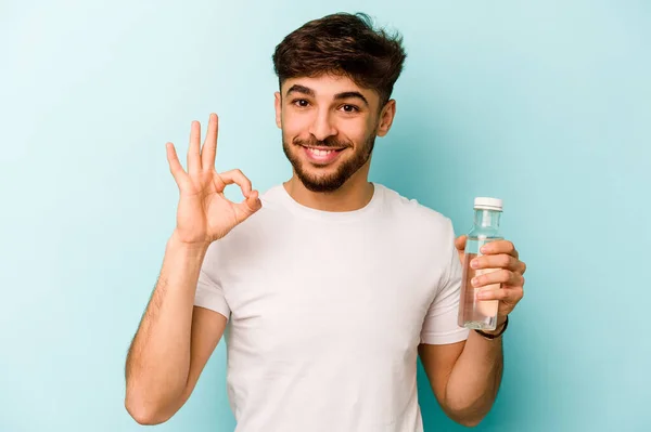 Young Hispanic Man Holding Bottle Water Isolated White Background Cheerful — Stock fotografie