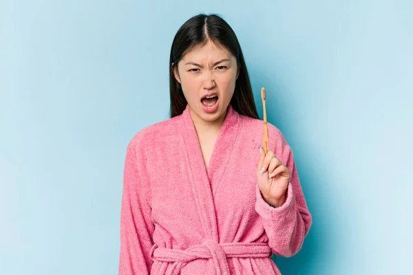 Young Asian Woman Wearing Bathrobe Brushing Teeth Isolated Pink Background — Stock Photo, Image