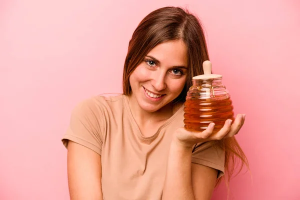 Young Caucasian Woman Holding Honey Isolated Pink Background — Stock Photo, Image