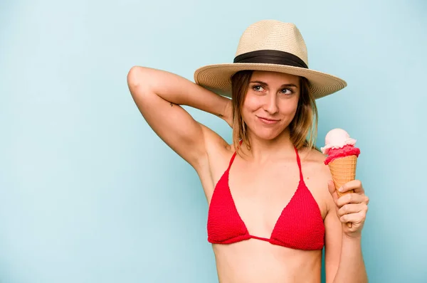 Young Caucasian Woman Wearing Bikini Holding Ice Cream Isolated Blue — Stock Photo, Image