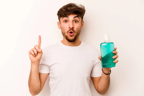 Young Hispanic Man Holding Mouthwash Isolated White Background Having Some — Stok Foto