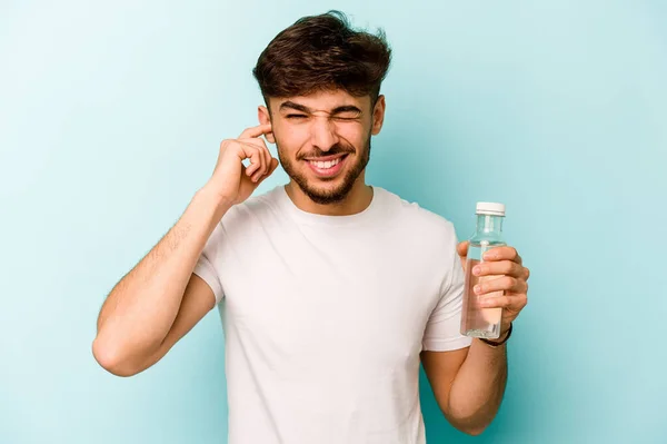 Young Hispanic Man Holding Bottle Water Isolated White Background Covering — Stock fotografie