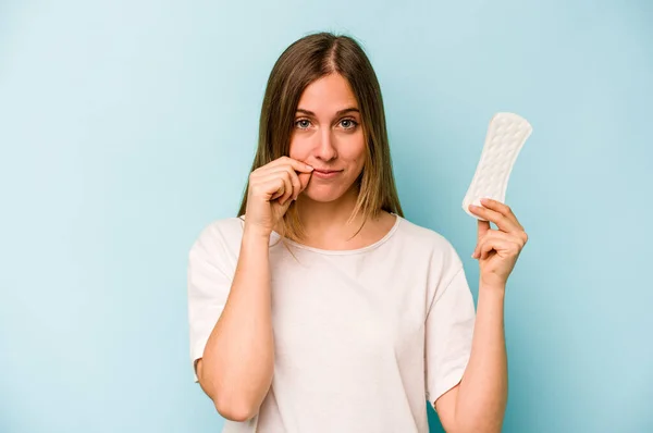 Young Caucasian Woman Holding Sanitary Napkin Isolated Blue Background Fingers — Stock Photo, Image