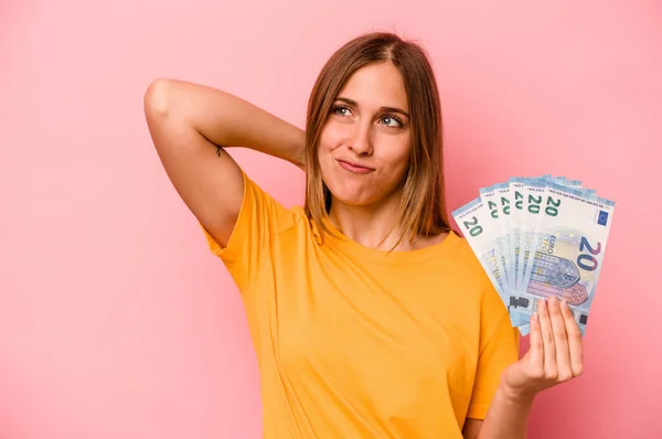 Young Caucasian Woman Holding Banknotes Isolated Pink Background Touching Back — Stock Photo, Image