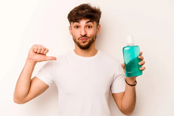 Young Hispanic Man Holding Mouthwash Isolated White Background Feels Proud — Stok fotoğraf