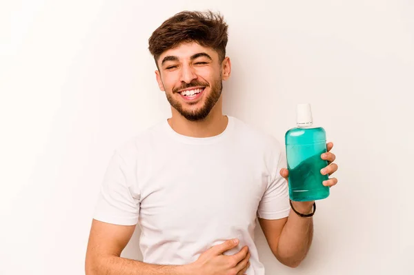 Young Hispanic Man Holding Mouthwash Isolated White Background Laughing Having — Stok Foto