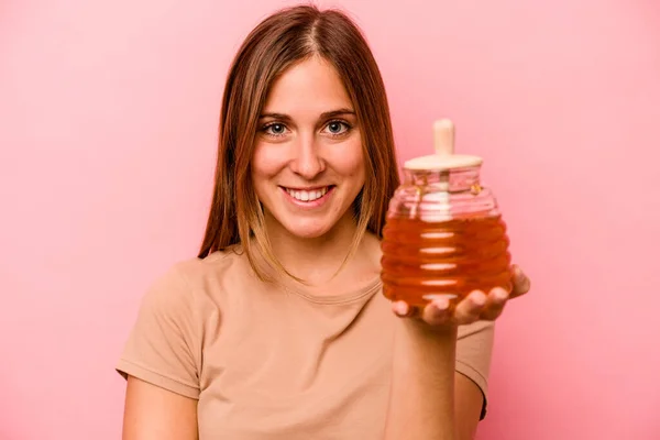 Young Caucasian Woman Holding Honey Isolated Pink Background — Stock Photo, Image