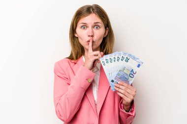 Genç İngiliz kadın banknotları beyaz arka planda soyutlayıp sır saklıyor ya da sessizlik istiyor..
