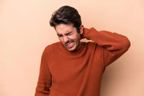 Young Caucasian Man Isolated Beige Background Suffering Neck Pain Due — Stock Photo, Image