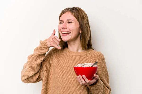 Jovem Inglesa Comendo Cereais Isolados Fundo Branco Mostrando Gesto Chamada — Fotografia de Stock