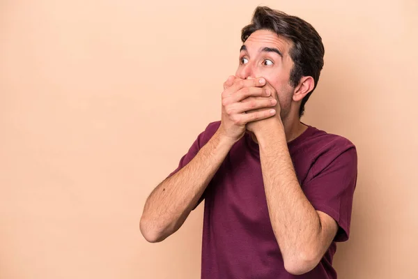 Young Caucasian Man Isolated Beige Background Thoughtful Looking Copy Space — Stock Photo, Image