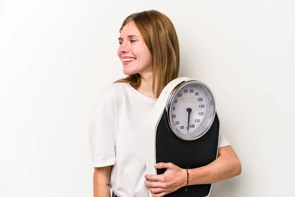 Young English Woman Holding Scale Isolated White Background Looks Aside — Stock Photo, Image