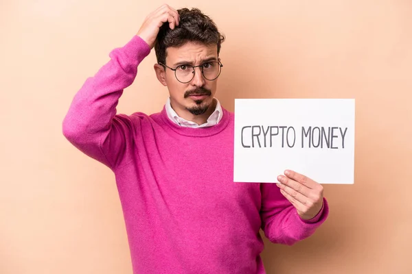 Giovane Uomo Caucasico Possesso Cartello Cripto Denaro Isolato Sfondo Beige — Foto Stock