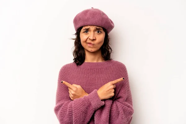 Young Hispanic Woman Isolated White Background Points Sideways Trying Choose — Stok fotoğraf