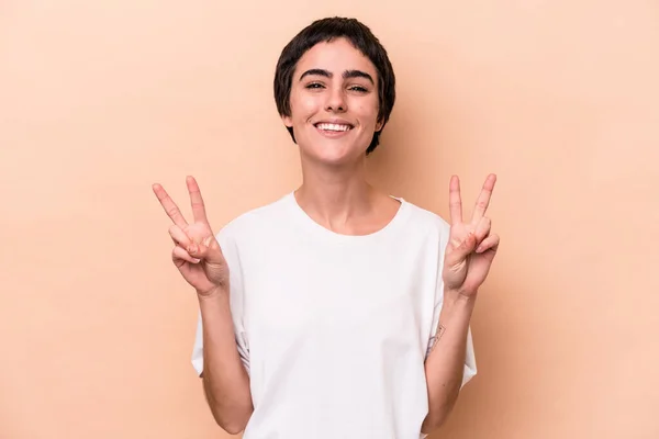 Young Caucasian Woman Isolated Beige Background Showing Victory Sign Smiling — 스톡 사진