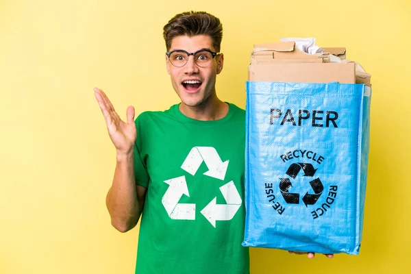 Young Caucasian Man Holding Recycling Bag Full Paper Recycle Isolated — Stockfoto