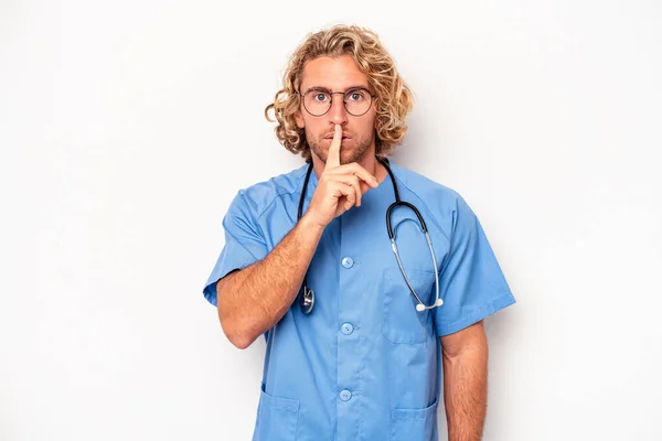 Young Nurse Caucasian Man Isolated White Background Keeping Secret Asking — Stock Photo, Image