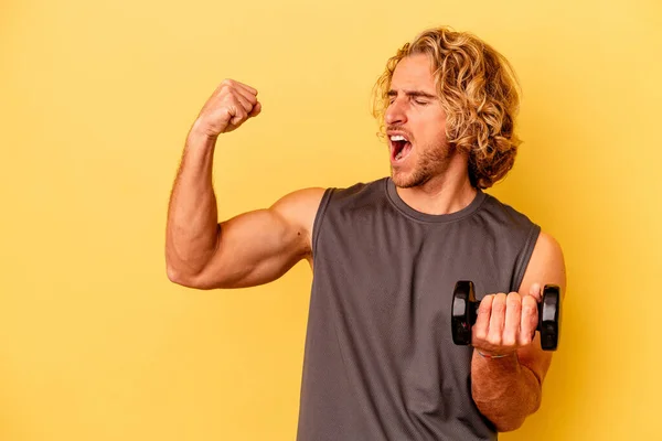 Young Sport Man Making Weightlifting Isolated Yellow Background Raising Fist — Stockfoto