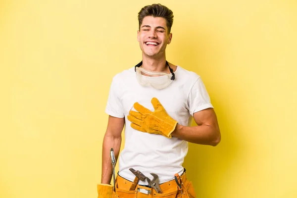 Young Electrician Caucasian Man Isolated Yellow Background Laughs Out Loudly — Fotografia de Stock