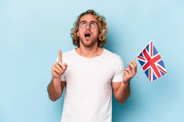 Young Student Caucasian Man Holding United Kingdom Flag Isolated Blue — Stock fotografie