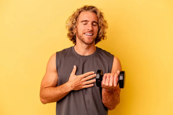 Young Sport Man Making Weightlifting Isolated Yellow Background Laughs Out — Foto Stock